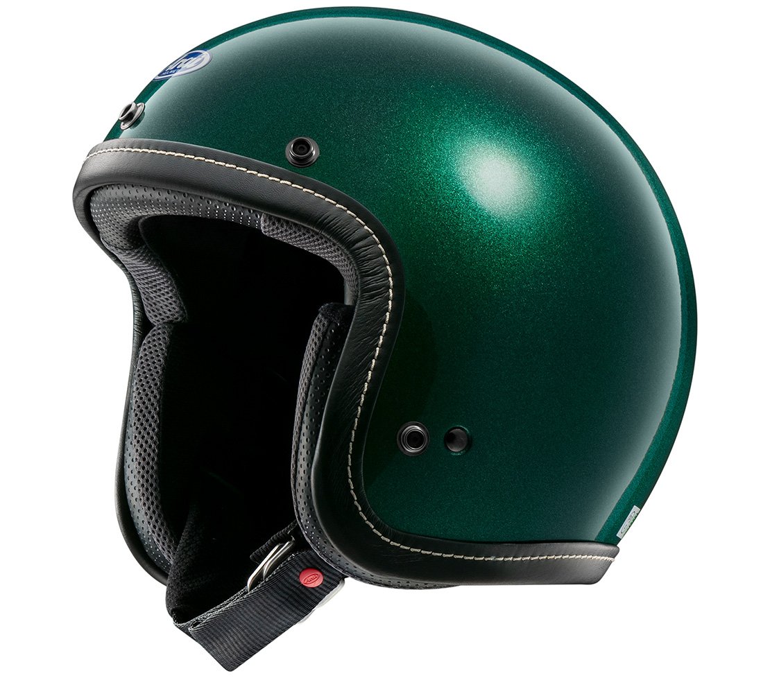 Rider wearing the Arai Classic-V helmet and goggles on a vintage-style motorcycle, showcasing its intended use.