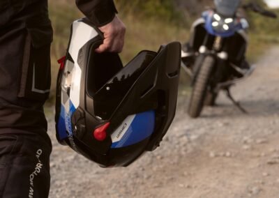 A close-up detail shot of the M-Forge™ Carbon and Aramid weave on the shell of the BMW GS Rallye Carbon helmet.