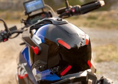 A close-up detail shot of the M-Forge™ Carbon and Aramid weave on the shell of the BMW GS Rallye Carbon helmet.