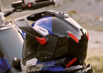 A close-up detail shot of the M-Forge™ Carbon and Aramid weave on the shell of the BMW GS Rallye Carbon helmet.
