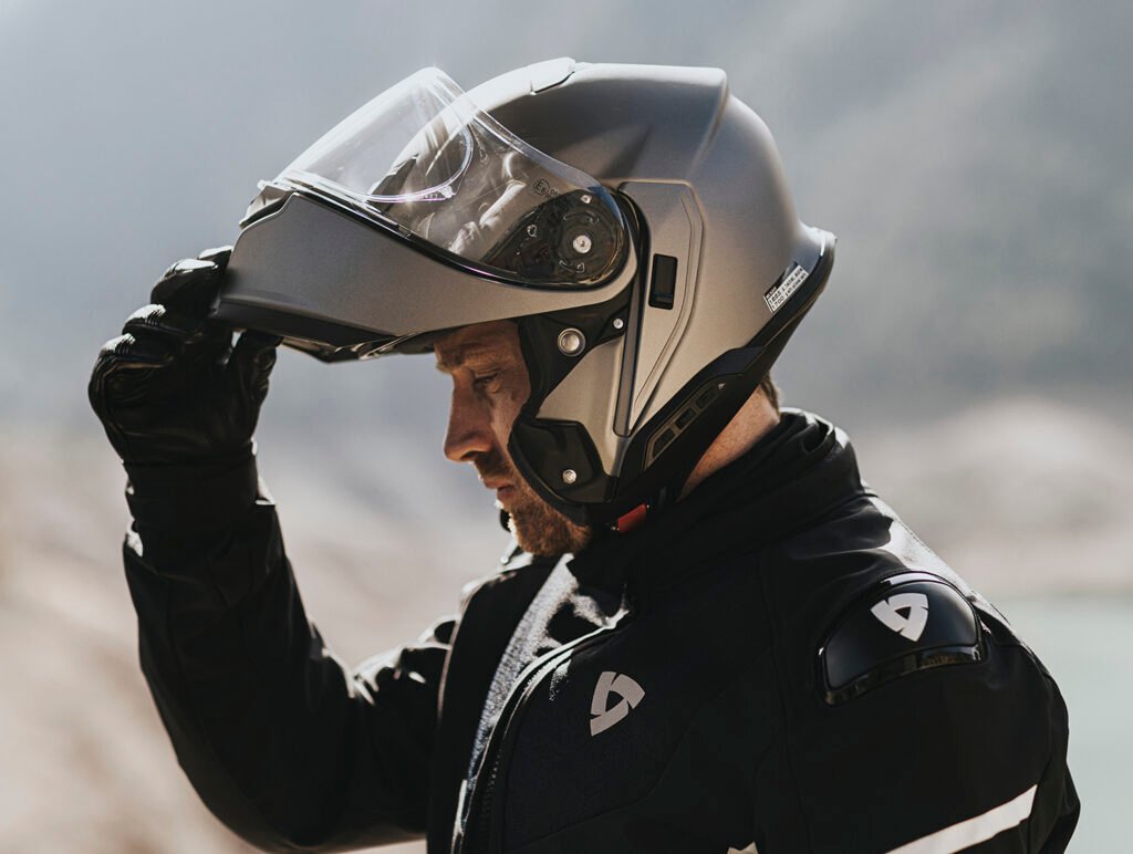 The Neotec 3 helmet with its chin bar in the fully raised, locked position, highlighting its P/J certification.