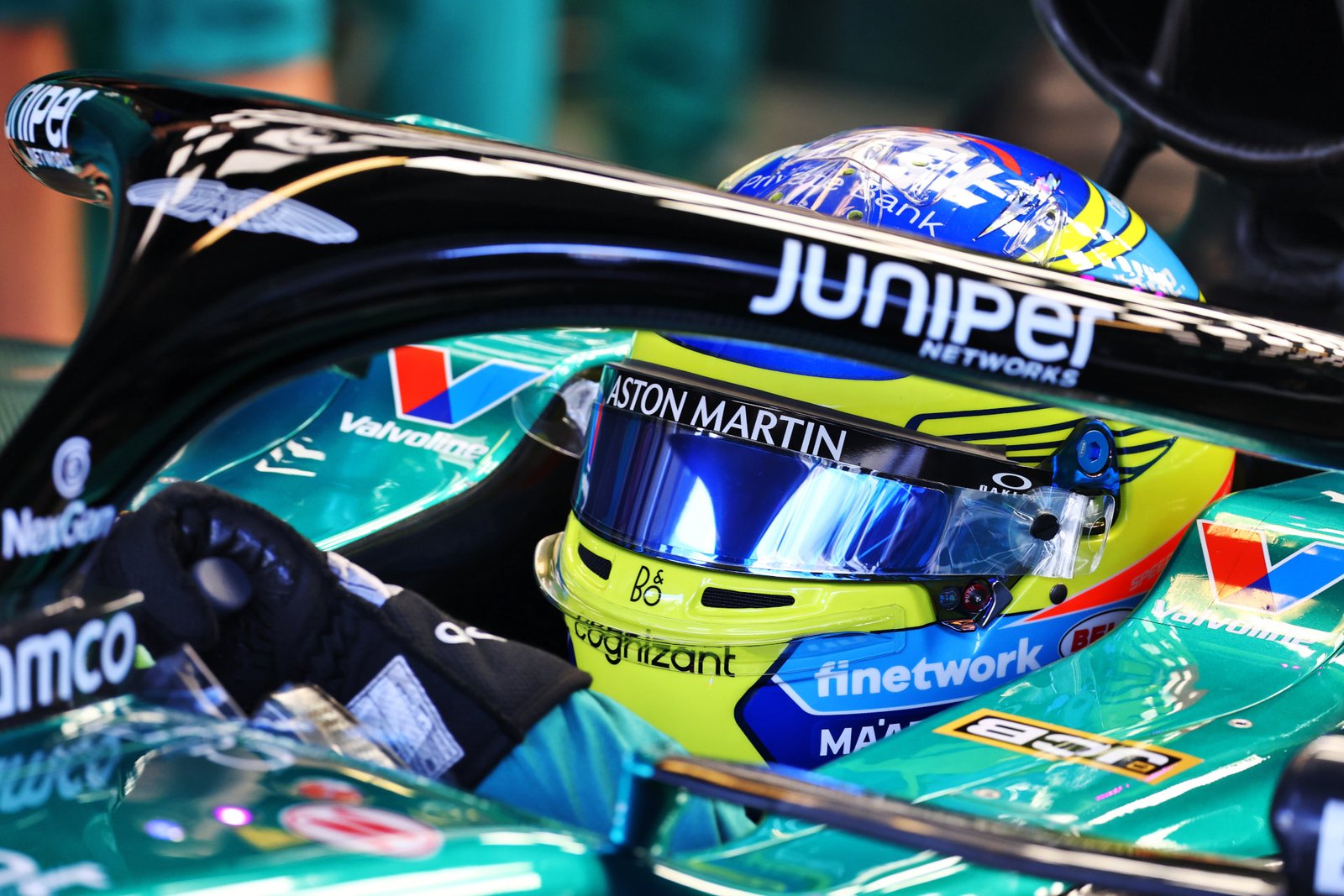 Formula 1 driver Fernando Alonso wearing a Bell helmet featuring the new SmartLock side visor lock.