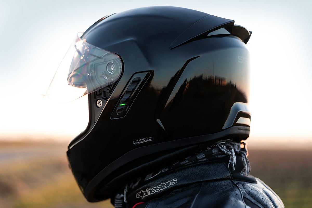 The integrated LED safety illumination of the Sena Phantom full face helmet, showing the front-facing light and rear brake light