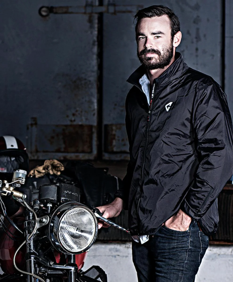 A rider wearing the slim-fitting Gerbing heated jacket liner before putting on their outer motorcycle jacket.