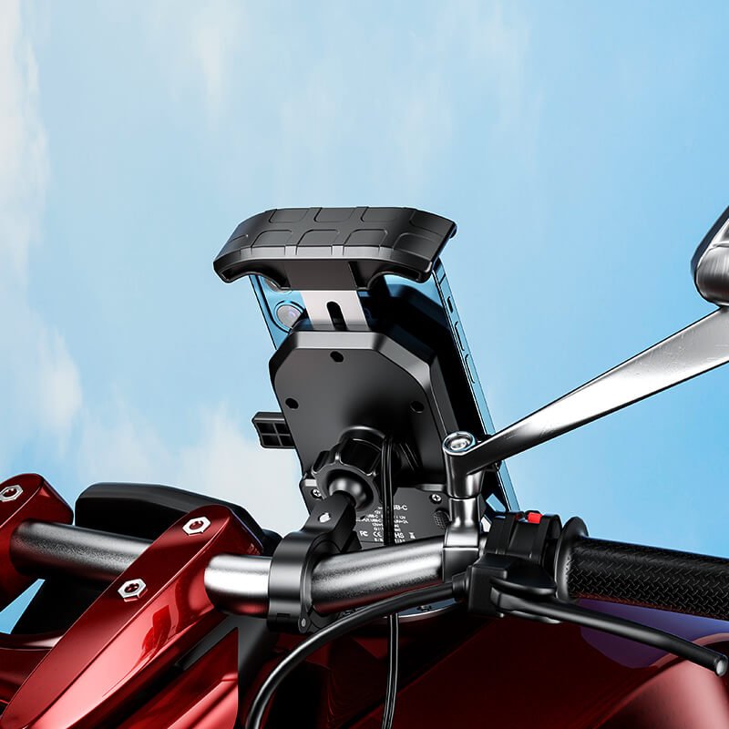 The IP66-rated housing of the KEWIG phone mount, showing the sealed USB-C port and the wireless charging surface.