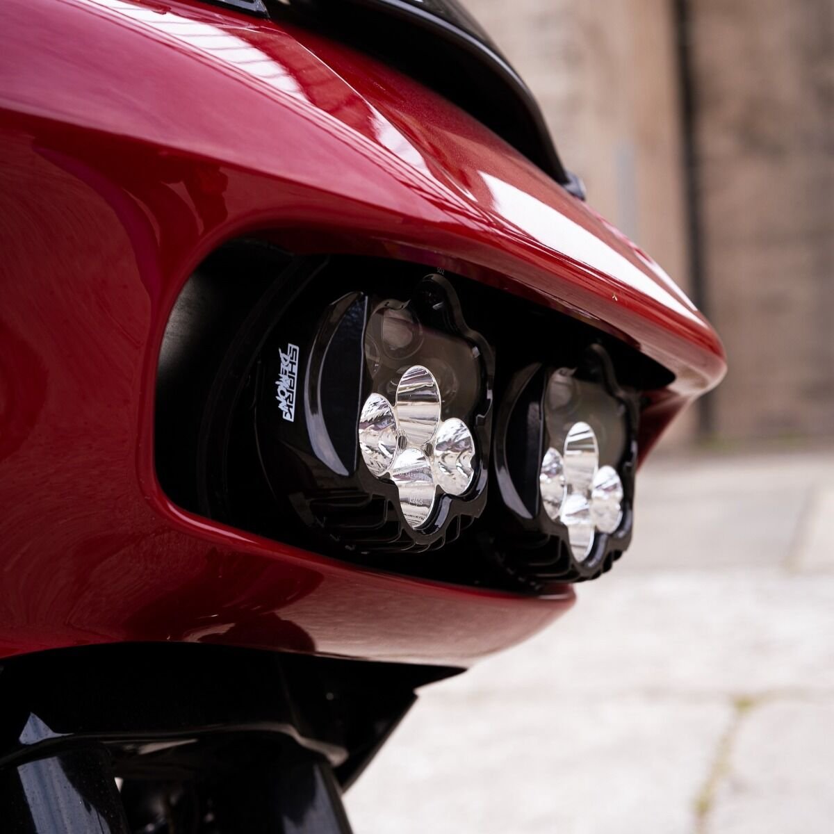 A Harley-Davidson Road Glide motorcycle parked in daylight, showcasing the aggressive styling of the installed Shark Demon 2 headlight.
